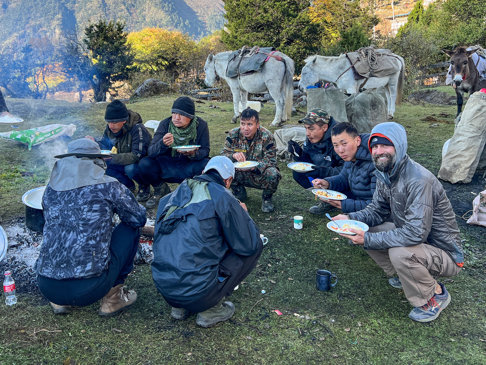 Eating breakfast by the campfire.