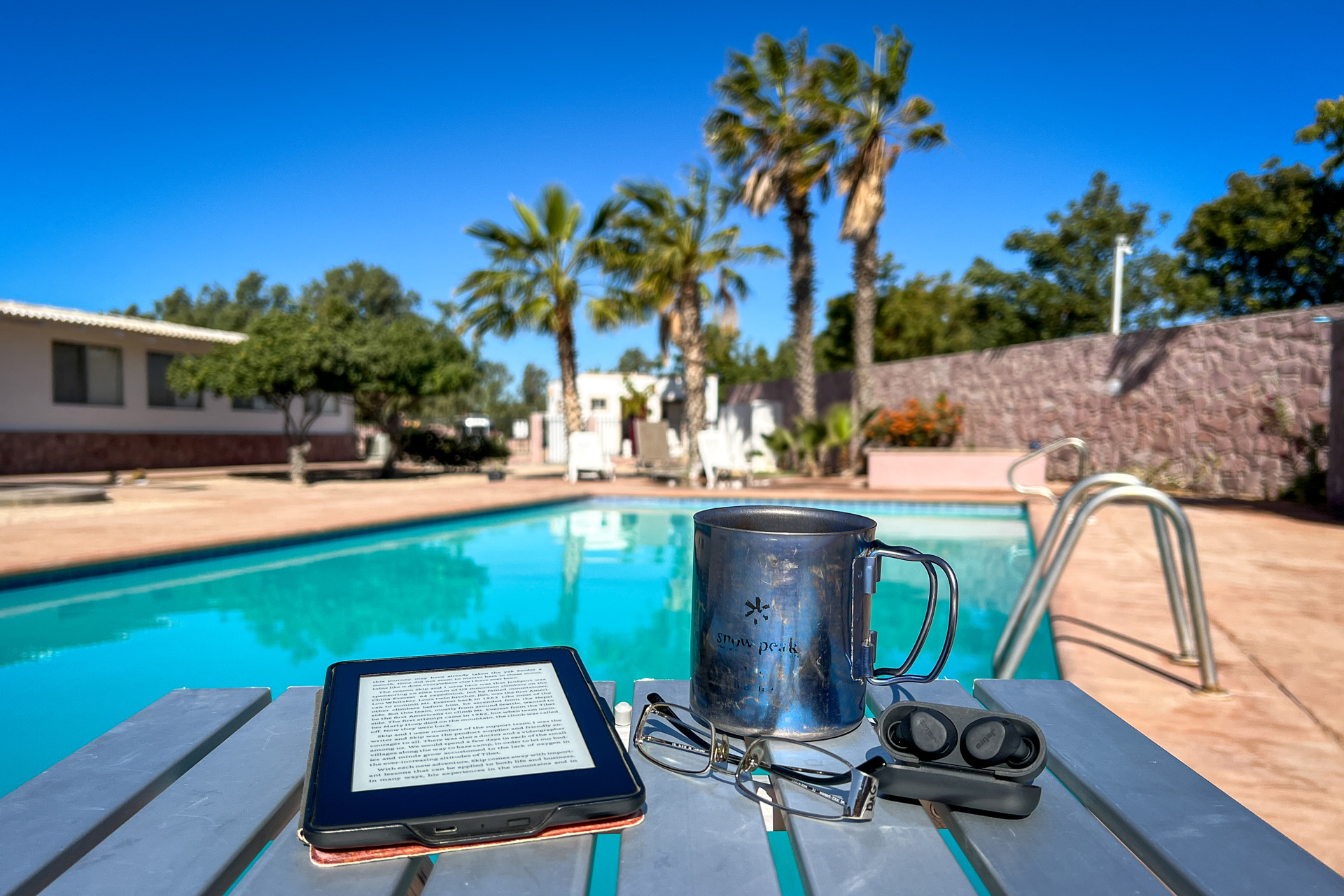 Reading by a pool.